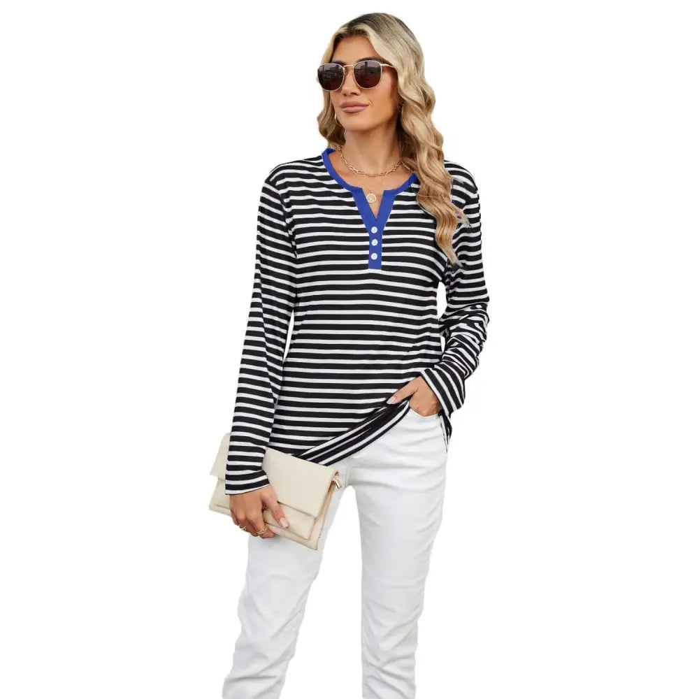 Women’s v-neck striped long-sleeved henley top with black and white stripes and a blue collar and button placket