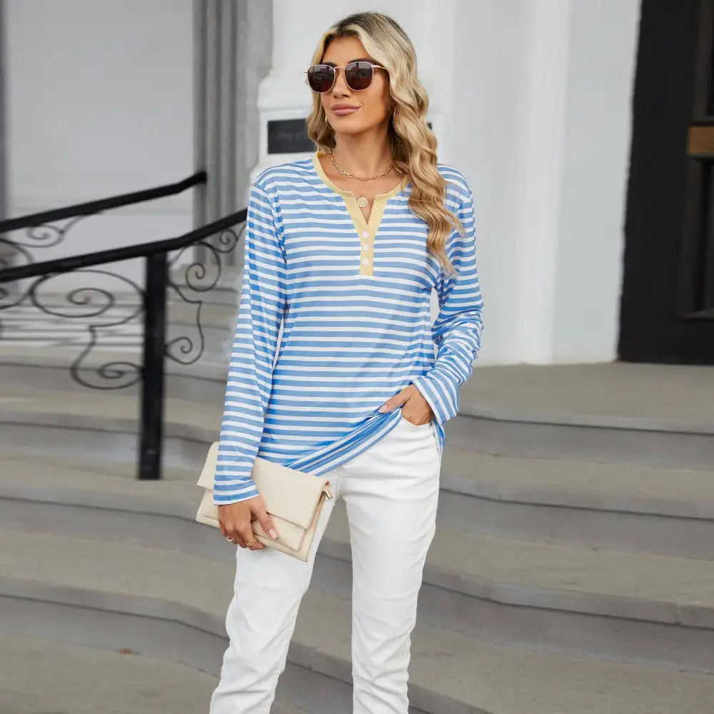 Women’s v-neck striped loose henley top in blue and white with long sleeves and contrasting yellow collar and button placket