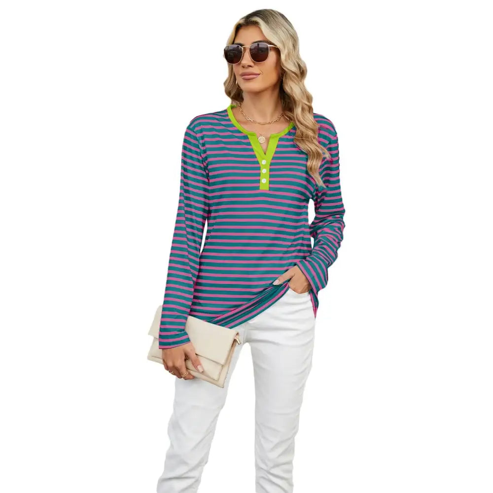 Women’s v-neck striped loose henley top with navy and pink stripes and a vibrant lime green collar and placket