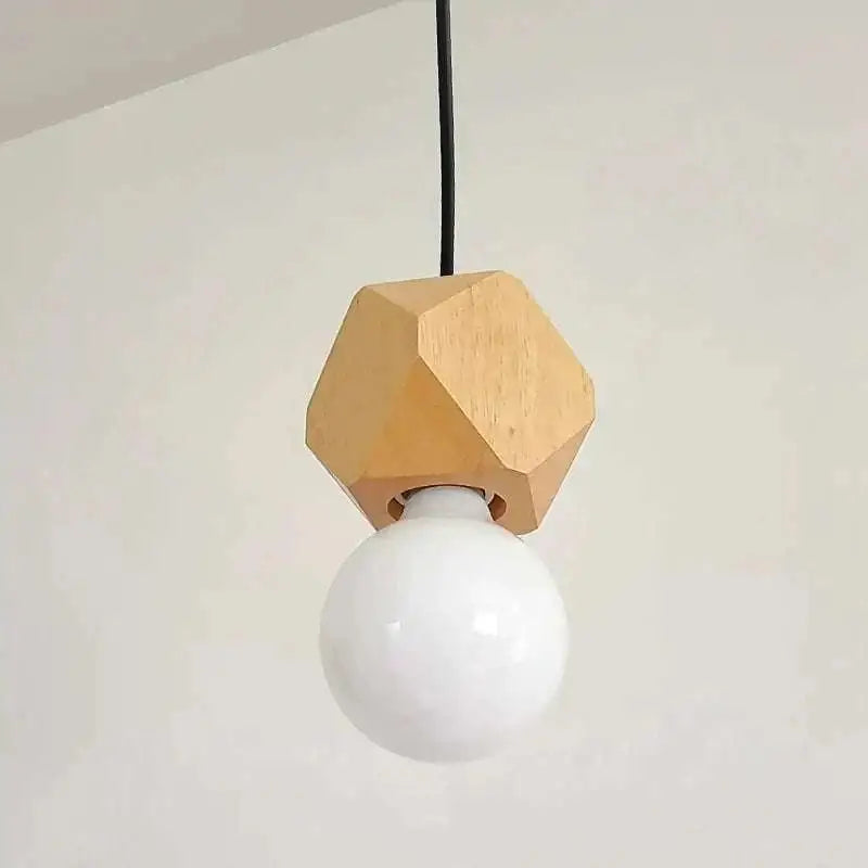 A minimalist hexagonal wood pendant light with a matte white edison glass bulb ideal for living room lighting