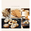 A wooden gear dim sum pastry cutter with handle displayed alongside assorted decorated cookies, crackers, and dumplings