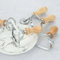Set of four stainless steel dim sum pastry cutters with wooden gear dim handles in heart and star shapes