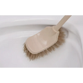 Beige plastic cleaning toilet brush with stiff light brown bristles and wooden household handle for effective cleaning