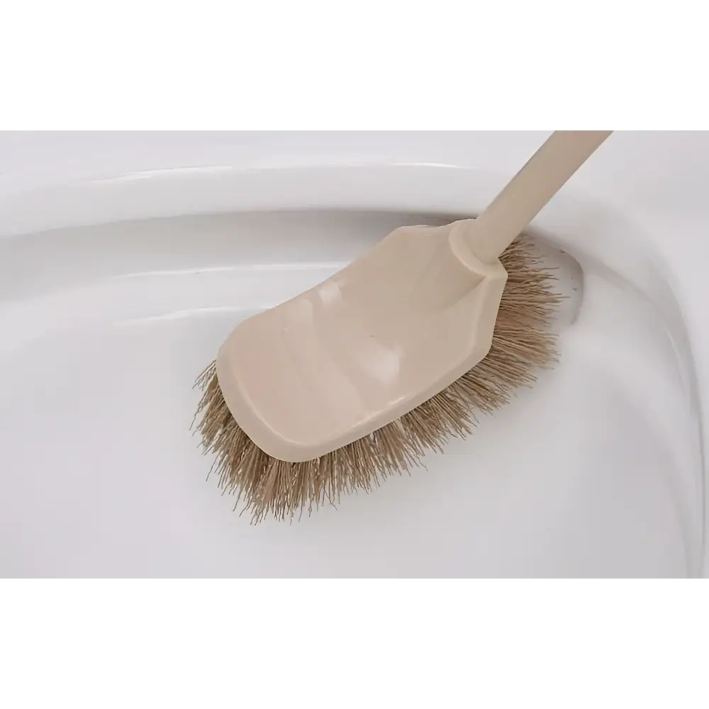 Beige plastic cleaning toilet brush with stiff light brown bristles and wooden household handle for effective cleaning