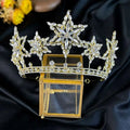 A sparkling gold xingx rhinestone fashion tiara crown with intricate crystal star and floral designs in metal framework