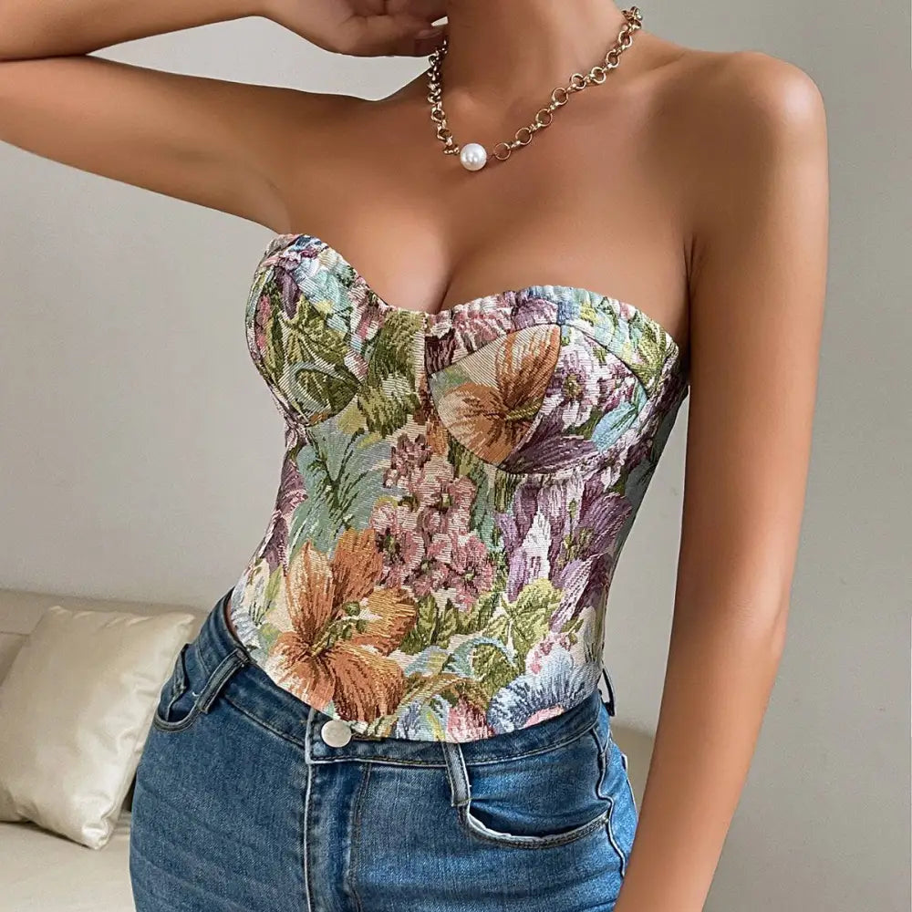 A y2k floral print tube corset top with textured fabric, strapless sweetheart neckline, and lace-up back detail