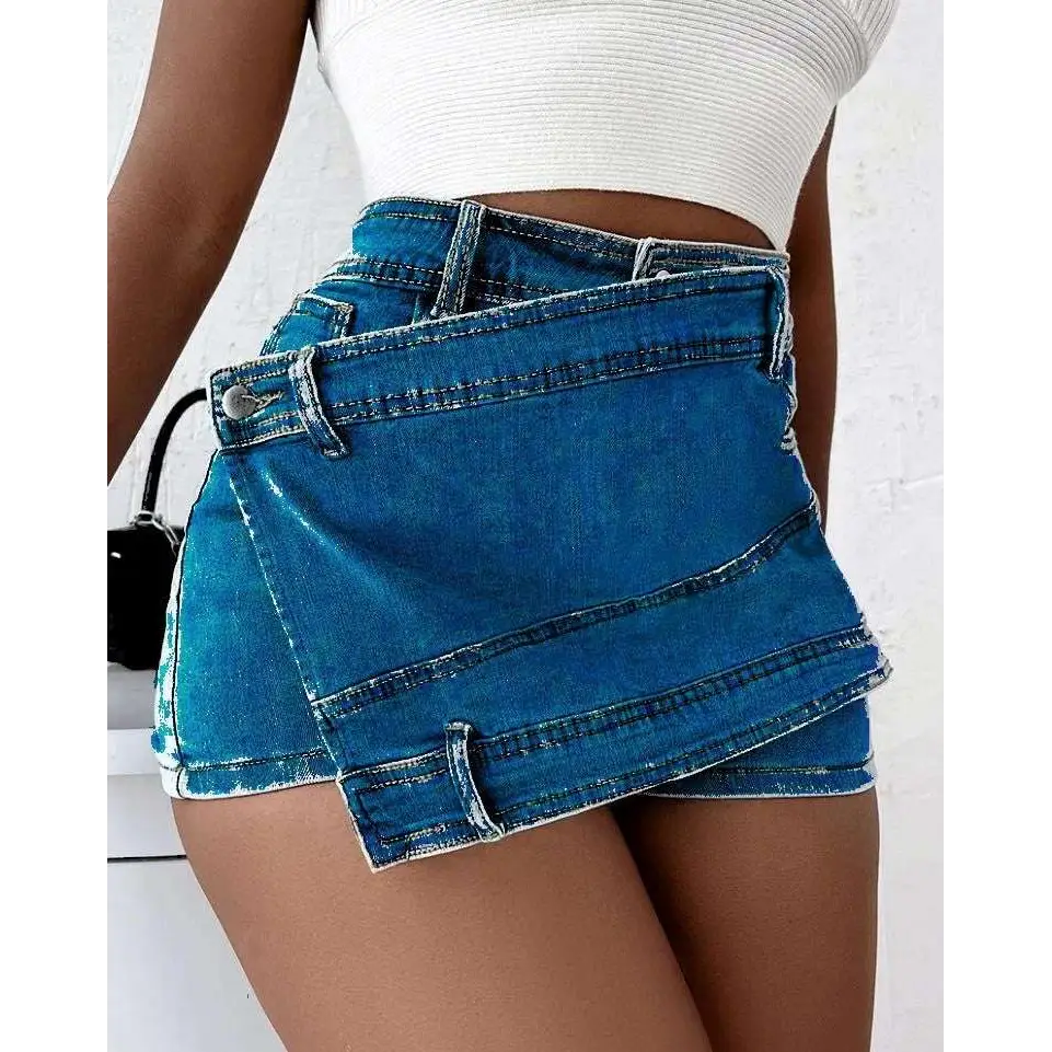 Blue denim mini skirt with layered asymmetrical design and button details in y2k street vintage denim skorts style
