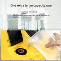 Yellow and black steam cleaner with transparent water tank being filled matching car cover color and black kitchen appliances