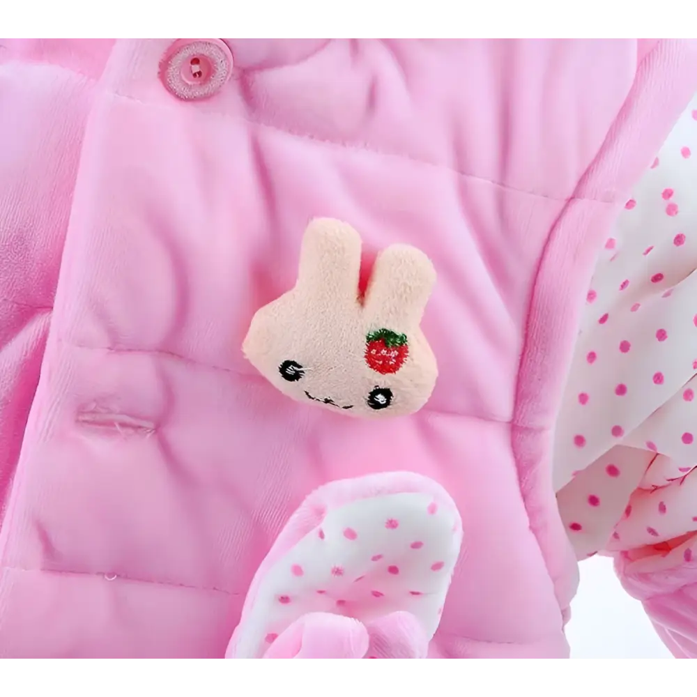 Pink quilted baby autumn clothing snowsuit with plush yellow bunny fleece patch and matching polka-dotted mittens