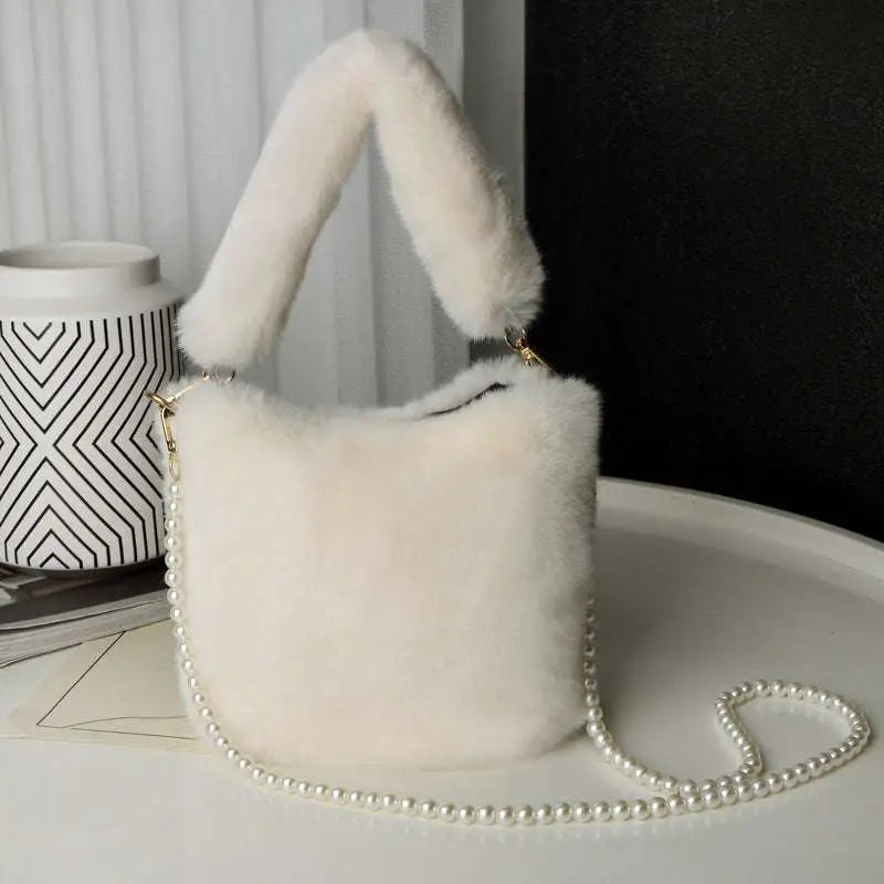 Yellow checkerboard plush bucket bag in off-white faux fur with plush handle and pearl chain design strap