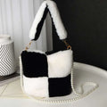 Black and white checkered plush bucket bag featuring a pearl chain design for stylish everyday use