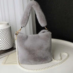 Soft light gray plush bucket bag with fluffy handle and pearl chain design inspired by yellow checkerboard style