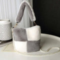 Cozy gray and white plush bucket bag in faux fur patchwork with a pearl chain design strap for stylish use