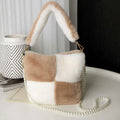 A cozy beige and white checkerboard plush bucket bag with soft faux fur and pearl chain design strap