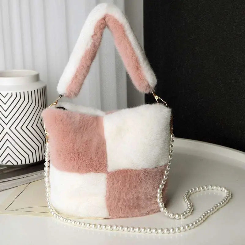 Soft pastel pink and white checkered plush bucket bag with bunny ear handles and pearl chain design strap