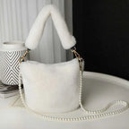 White faux fur handbag with fluffy handle and pearl chain design resembling a yellow checkerboard plush bucket bag
