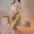 Yellow floral satin cross lace nightdress featuring delicate white lace trim and thin spaghetti straps for elegant sleepwear