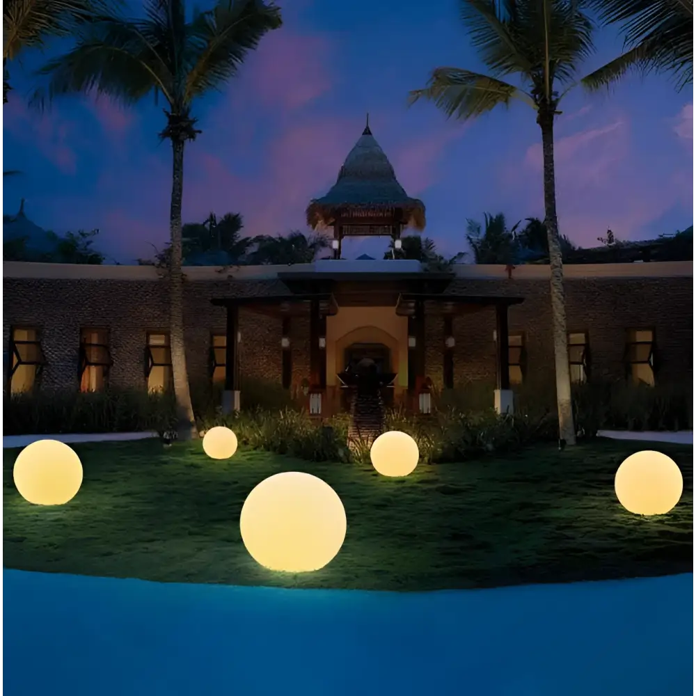 Yellow glowing spherical outdoor lights emitting warm light ideal for garden and patio decoration