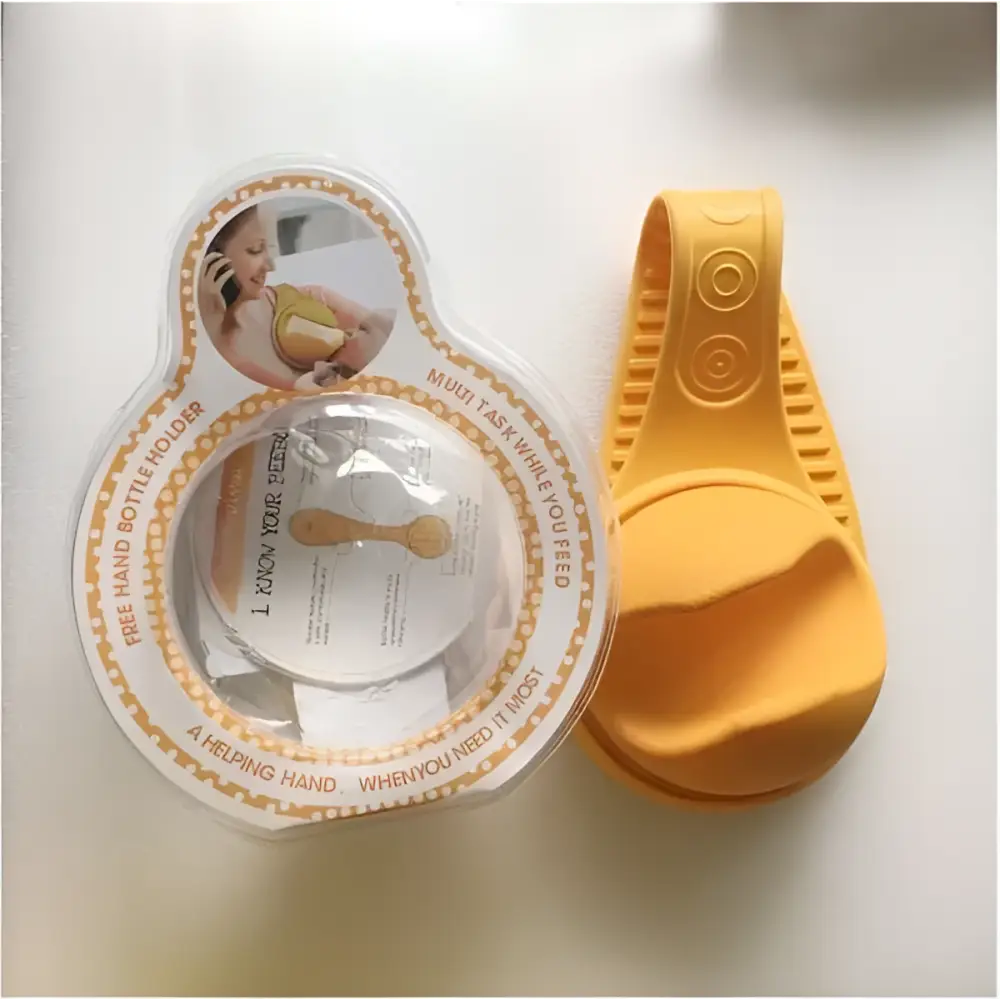Yellow hands free baby bottle holder with clear plastic bottle attached for convenient hands free feeding