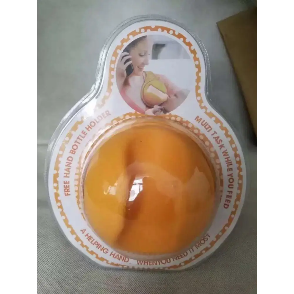 Yellow hands free baby bottle holder orange silicone free baby bottle holder in clear plastic packaging
