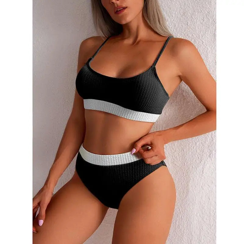 Black textured bikini set with white bands featuring a high waist design in a yellow ribbed high waist bikini collection