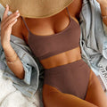 Brown ribbed two-piece swimsuit with high waist bikini bottoms and cropped top in a yellow ribbed high style