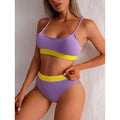 Purple and yellow ribbed two-piece swimsuit with a high waist bikini bottom in yellow ribbed high waist design