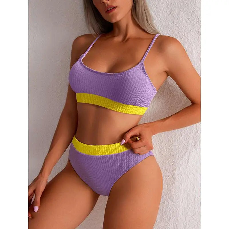 Purple and yellow ribbed two-piece swimsuit with a high waist bikini bottom in yellow ribbed high waist design