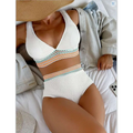 White knitted two-piece swimsuit with v-neck top and coral mint striped waistband, styled as a high waist bikini alternative