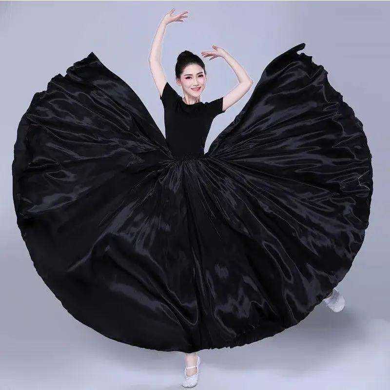 A flowing black satin solid color dance skirt with dramatic wide flare and smooth glossy texture for color performance skirt