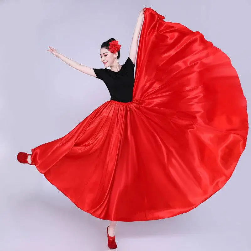 Vibrant red satin solid color dance skirt with a flowing full silhouette and matching floral hair accessory