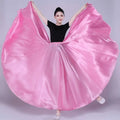 A flowing vibrant pink satin solid color dance skirt with a smooth glossy finish and wide flared hem for performance