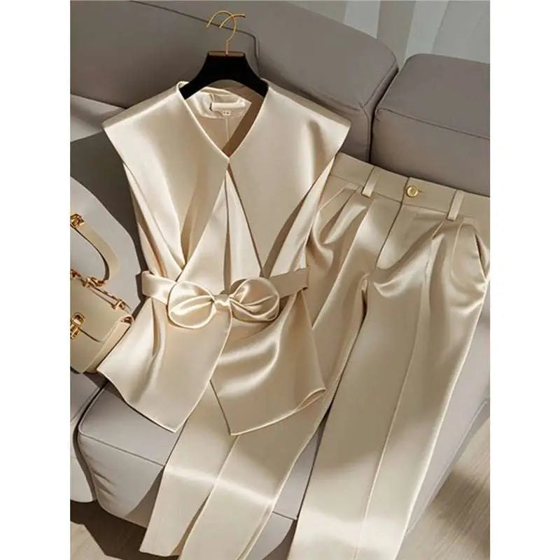 Cream satin sleeveless top with v-neck and matching bow belt in youthful fashionable champagne western style design
