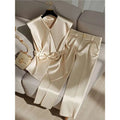 Cream satin sleeveless top with v-neck and matching bow belt in youthful fashionable champagne western style design