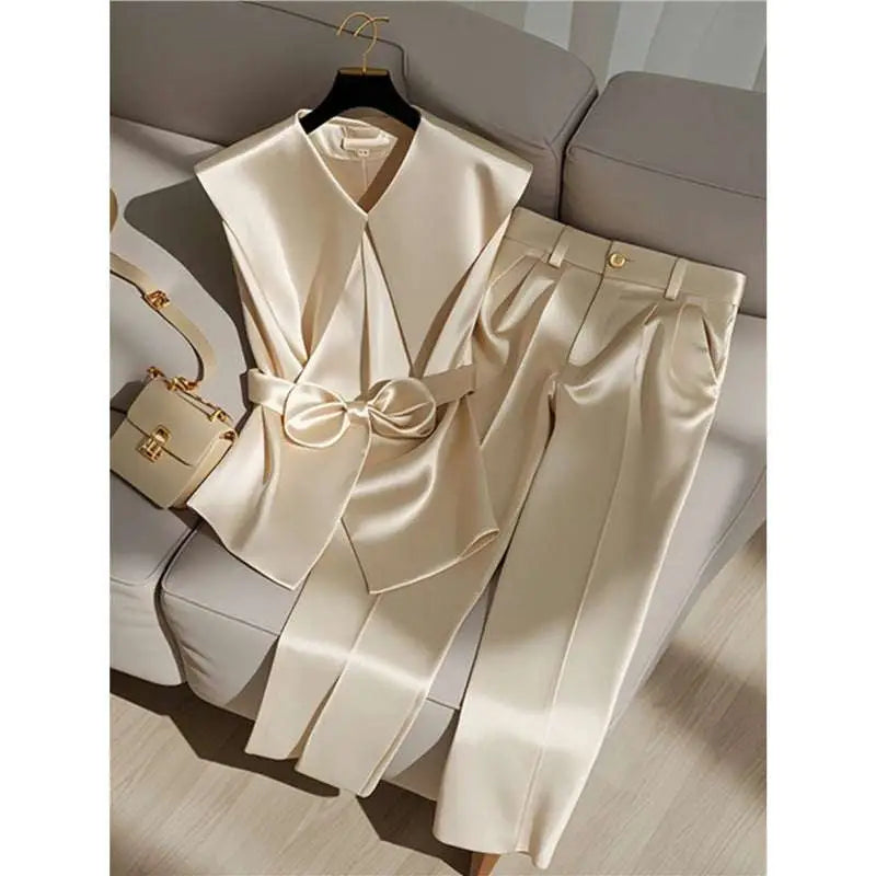 Cream satin sleeveless top with v-neck and matching bow belt in youthful fashionable champagne western style design