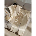 Cream satin sleeveless top with wide collar and front bow detail for youthful fashionable champagne outfits