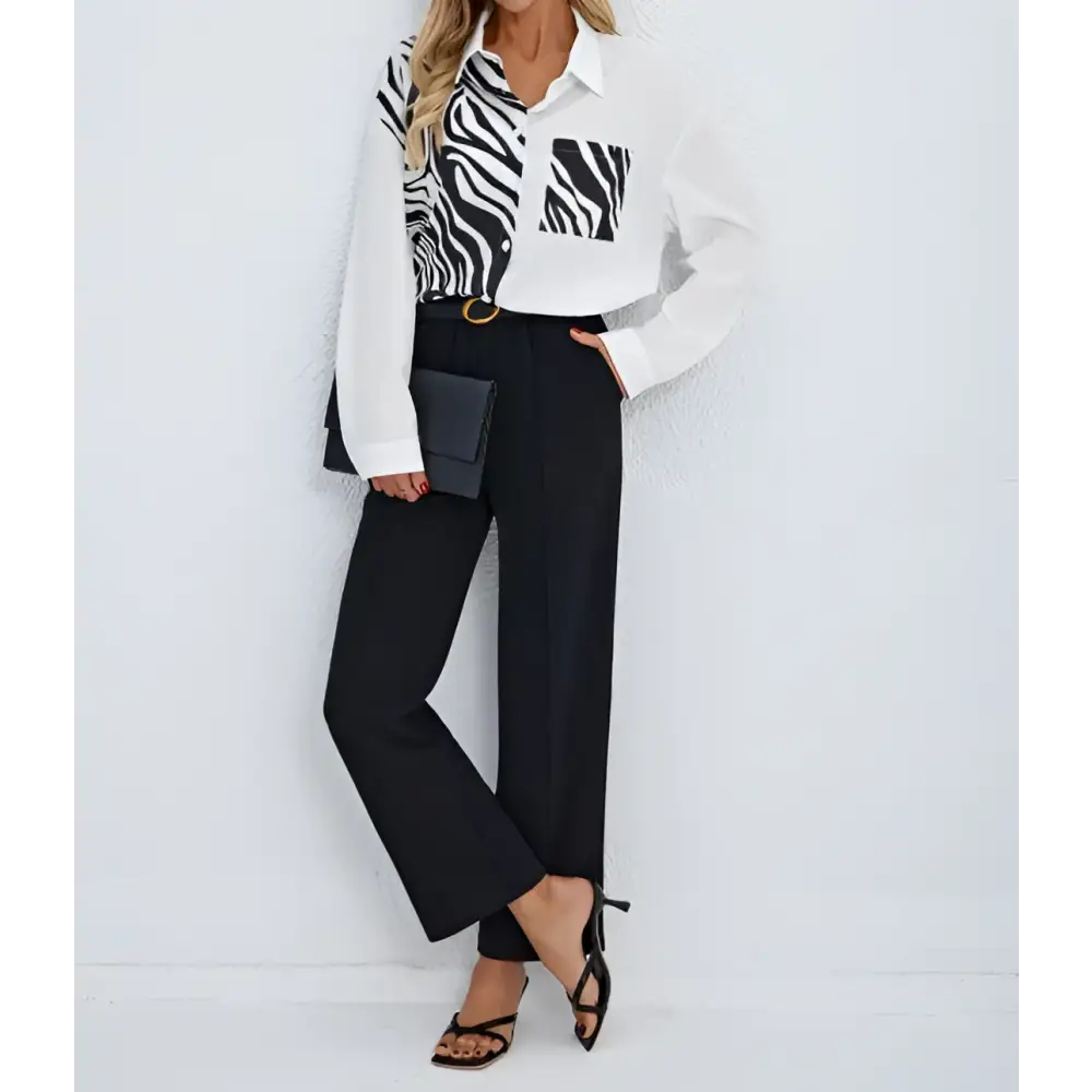 A stylish zebra ladies collar print button chest pocket shirt in white and black with long sleeves and button-down front