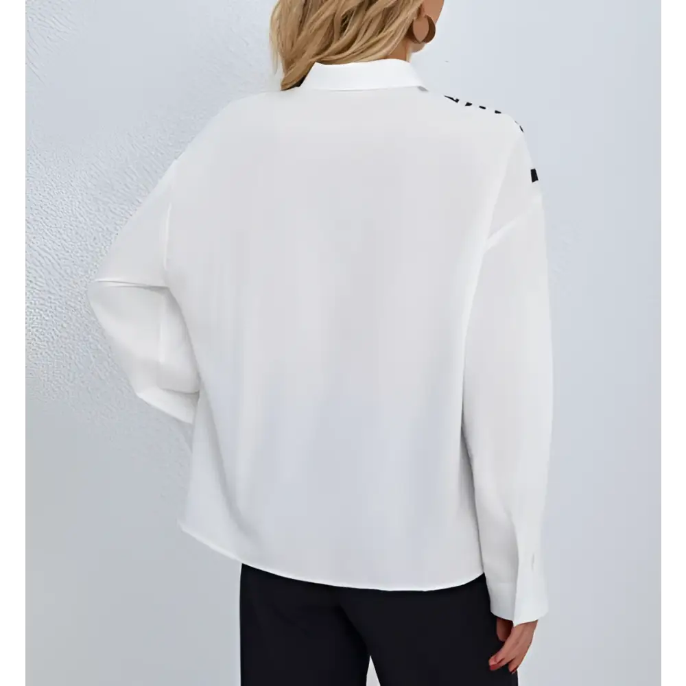 White satin zebra ladies collar chest pocket shirt with black geometric shoulder accents and collar print button details