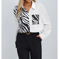 White long-sleeved zebra ladies collar print button chest pocket shirt with black zebra print on sleeves and chest pocket