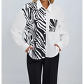 A stylish white zebra ladies collar print button chest pocket shirt with bold black and white zebra print detailing on one side