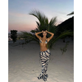 A black and white zebra printed bikini with a strappy triangle top and high-waisted flowing pants casual suit