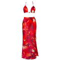 A vibrant red and orange abstract floral print two-piece zebra printed bikini with a printed bikini strappy skirt casual set