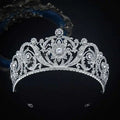 An ornate silver zircon bride crown tiara with intricate floral patterns and sparkling clear crystals for crown fashion headwear