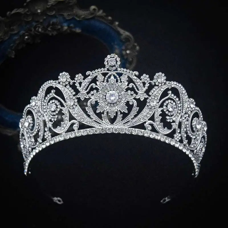 An ornate silver zircon bride crown tiara with intricate floral patterns and sparkling clear crystals for crown fashion headwear
