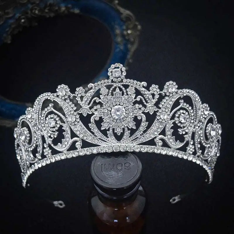 A sparkling silver zircon bride crown with ornate floral and scrollwork designs for crown fashion headwear