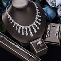 A sparkling silver-toned zircon necklace earrings bracelet ring set with floral design on black velvet bust