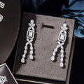 Elegant silver zircon necklace earrings with cascading cubic zirconia stones in floral and teardrop design from bracelet ring set