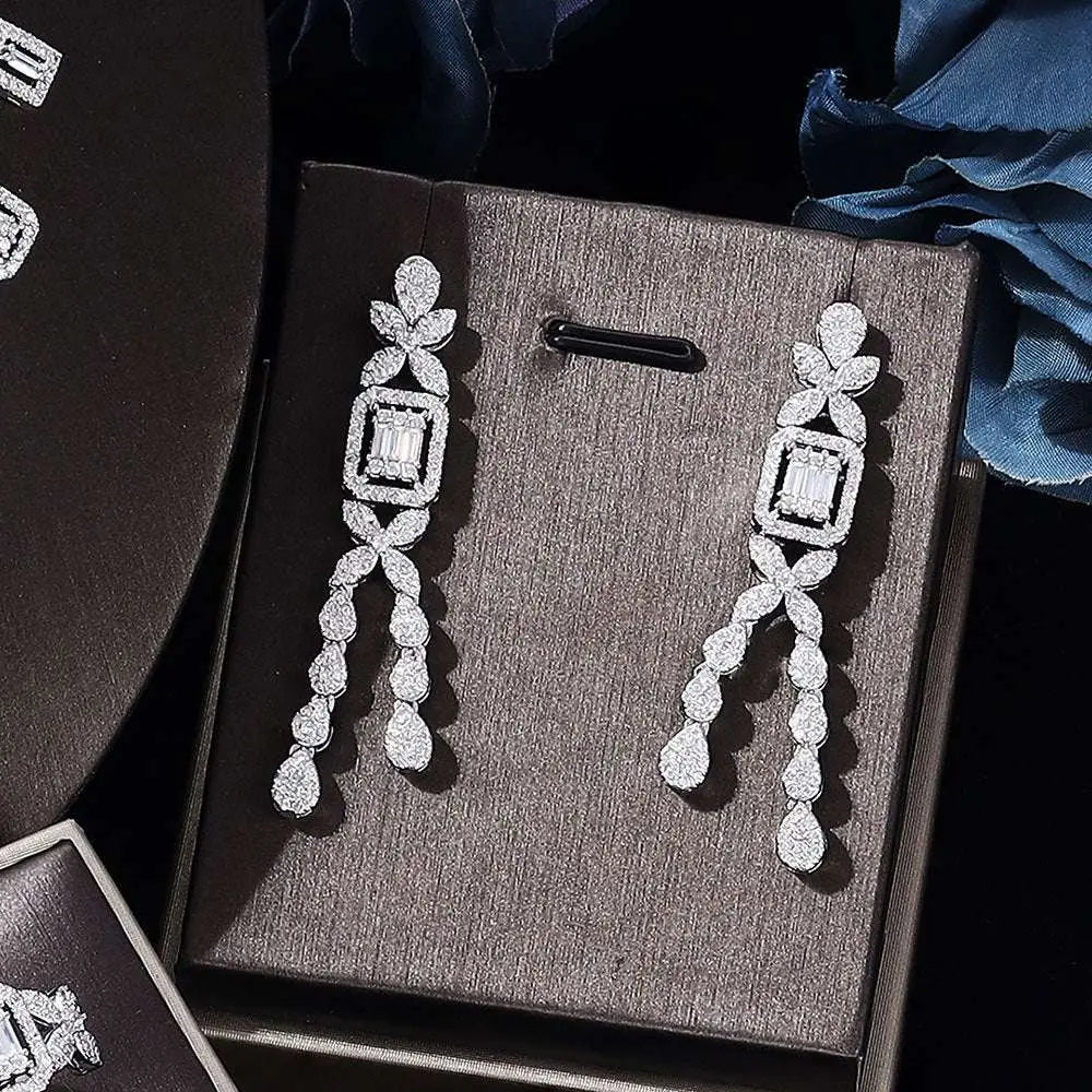 Elegant silver zircon necklace earrings with cascading cubic zirconia stones in floral and teardrop design from bracelet ring set