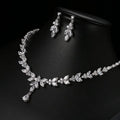 Zircon simple bridal set with silver leaf and crystal necklace and matching leaf crystal earrings featuring delicate vine design