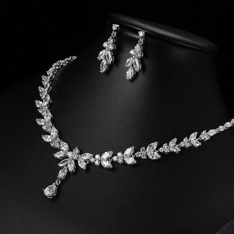 Zircon simple bridal set with silver leaf and crystal necklace and matching leaf crystal earrings featuring delicate vine design